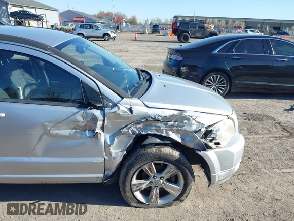 2012 Dodge Caliber SXT with VIN 1C3CDWDAXCD508338, listed as a IAAI auction lot 42091675 with 213,596 mi miles and . Bid and sale history available at DreamBid. Image 6.