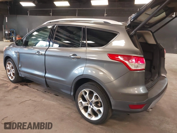 2014 Ford Escape Titanium with VIN 1FMCU9JX0EUE45254, listed as a IAAI auction lot 42038700 with 60,103 mi miles. Bid and sale history available at carsss.com. Image 3.