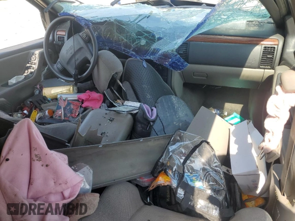 1999 Jeep Grand Cherokee Laredo с VIN 1J4G258S9XC758711, выставлен на аукционе Copart как лот 58420835 с пробегом Не указан миль и Списание • Salvage title. История ставок и продаж доступна на DreamBid. Изображение 8.
