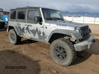 2015 Jeep Wrangler Unlimited Willys Wheeler with VIN 1C4BJWDG7FL690952, listed as a Copart auction lot 51493715 with 45,497 mi miles and Salvage Title. Bid and sale history available at DreamBid. Image 4.