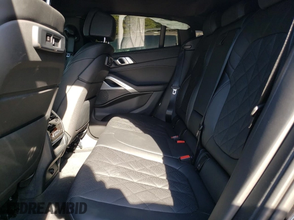 2023 BMW X6 xDrive40i z VIN 5UXCY6C04P9P46153, wystawiony jako Copart lot #81151634 z przebiegiem Nie podano mil oraz Szkoda całkowita • Salvage title. Historia ofert i sprzedaży dostępna na DreamBid. Obrazek 11.