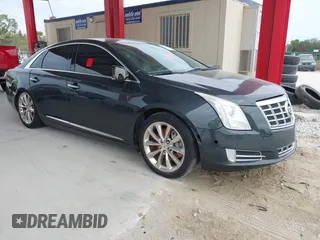 2014 Cadillac XTS Luxury with VIN 2G61M5S33E9217619, listed as a IAAI auction lot 41343003 with 126,303 mi miles. Bid and sale history available at carsss.com. Image 1.