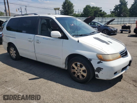 2002 Honda Odyssey EX with VIN 2HKRL18662H562178, listed as a Copart auction lot 63787995 with 256,072 mi miles and Salvage title. Bid and sale history available at DreamBid. Image 4.