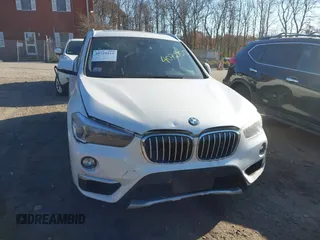 2019 BMW X1 xDrive28i with VIN WBXHT3C57K5L89697, listed as a IAAI auction lot 40729513 with 46,319 mi miles and . Bid and sale history available at DreamBid. Image 12.