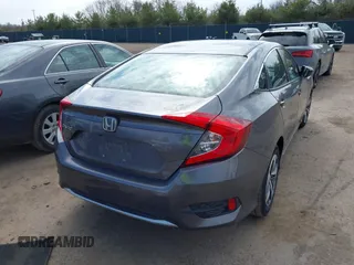 2019 Honda Civic LX with VIN 19XFC2F61KE037495, listed as a IAAI auction lot 41891007 with 90,262 mi miles and . Bid and sale history available at DreamBid. Image 4.