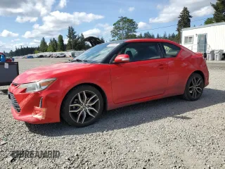 2014 Scion tC z VIN JTKJF5C79E3077490, wystawiony jako Copart lot #56399805 z przebiegiem 141 964 mil mil oraz Szkody całkowita. Historia ofert i sprzedaży dostępna na DreamBid. Obrazek 1.