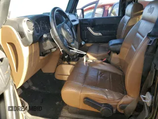2011 Jeep Wrangler Sahara with VIN 1J4GA5D16BL567739, listed as a Copart auction lot 73542244 with 282,392 mi miles and Non Repairable. Bid and sale history available at DreamBid. Image 7.
