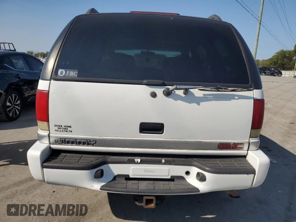 2000 GMC Jimmy SLE Convenience z VIN 1GKDT13W5Y2200634, wystawiony jako Copart lot #69860014 z przebiegiem 172 179 mil mil oraz Szkody całkowita. Historia ofert i sprzedaży dostępna na DreamBid. Obrazek 6.