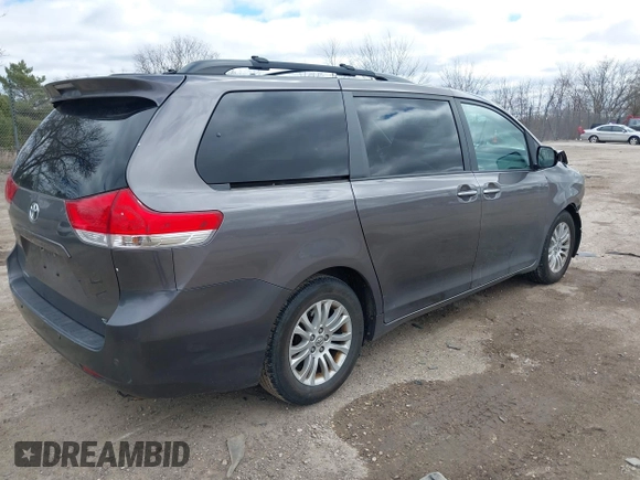 2014 Toyota Sienna XLE with VIN 5TDYK3DC0ES422700, listed as a IAAI auction lot 42049181 with 147,498 mi miles. Bid and sale history available at carsss.com. Image 4.