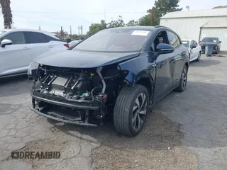 2023 Volkswagen ID.4 Pro z VIN 1V2DNPE8XPC019169, wystawiony jako IAAI lot #41313501 z przebiegiem 32 552 mil mil oraz . Historia ofert i sprzedaży dostępna na DreamBid. Obrazek 2.