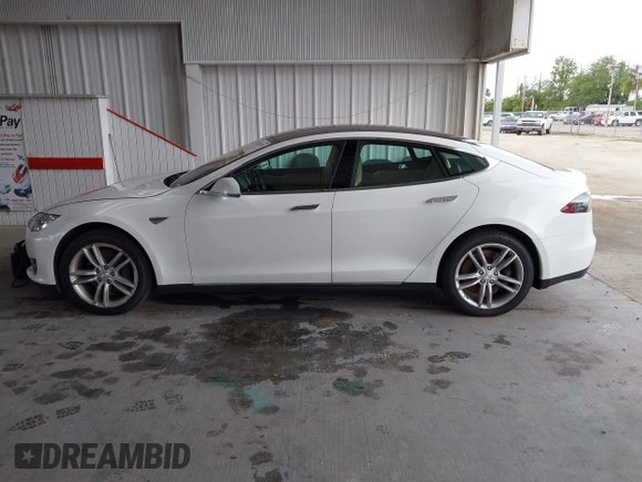 2014 Tesla Model S 60 with VIN 5YJSA1S16EFP53350, listed as a IAAI auction lot 42239753 with 104,985 mi miles and . Bid and sale history available at DreamBid. Image 14.