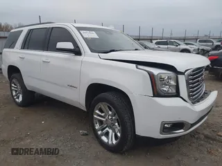 2018 GMC Yukon SLT with VIN 1GKS1BKC3JR279163, listed as a IAAI auction lot 40973940 with 122,445 mi miles. Bid and sale history available at carsss.com. Image 1.