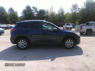 2014 Mazda CX-5 Touring z VIN JM3KE2CYXE0429149, wystawiony jako IAAI lot #42471772 z przebiegiem 222 440 mil mil oraz . Historia ofert i sprzedaży dostępna na DreamBid. Obrazek 13.