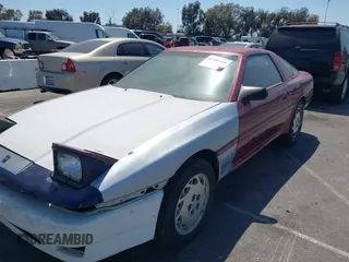 1986 Toyota Supra z VIN JT2MA70J2G0023623, wystawiony jako IAAI lot #42100560 z przebiegiem 182 271 mil mil oraz . Historia ofert i sprzedaży dostępna na DreamBid. Obrazek 6.