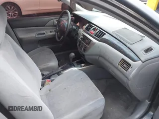 2004 Mitsubishi Lancer ES with VIN JA3AJ26E54U054570, listed as a IAAI auction lot 41592397 with 220,140 mi miles. Bid and sale history available at carsss.com. Image 5.