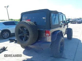 2014 Jeep Wrangler Unlimited Sport with VIN 1C4BJWDG4EL295044, listed as a IAAI auction lot 41997837 with 143,447 mi miles. Bid and sale history available at carsss.com. Image 16.