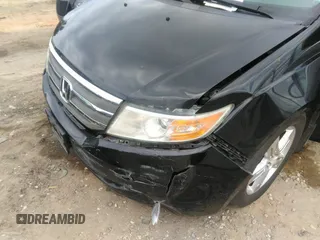 2012 Honda Odyssey Touring with VIN 5FNRL5H97CB066596, listed as a IAAI auction lot 42472935 with 217,182 mi miles and . Bid and sale history available at DreamBid. Image 6.