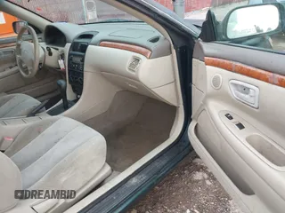 2001 Toyota Solara SE z VIN 2T1CG22P31C437576, wystawiony jako IAAI lot #42447345 z przebiegiem 164 366 mil mil oraz . Historia ofert i sprzedaży dostępna na DreamBid. Obrazek 5.