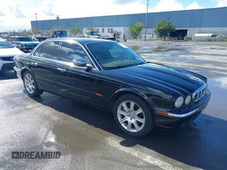 2004 Jaguar XJ with VIN SAJEA74C94SG11224, listed as a IAAI auction lot 41732975 with 204,815 mi miles and . Bid and sale history available at DreamBid. Image 1.