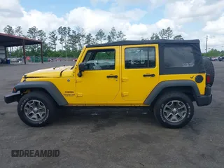 2015 Jeep Wrangler Unlimited Willys Wheeler with VIN 1C4BJWDG2FL643375, listed as a IAAI auction lot 42109724 with 112,357 mi miles and . Bid and sale history available at DreamBid. Image 14.