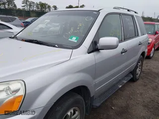 2004 Honda Pilot EX with VIN 2HKYF18494H525047, listed as a IAAI auction lot 41927610 with 999,999 mi miles. Bid and sale history available at carsss.com. Image 6.