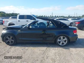 2011 BMW 1 Series 128i with VIN WBAUL7C54BVM80474, listed as a IAAI auction lot 42031032 with 76,617 mi miles and . Bid and sale history available at carsss.com. Image 14.