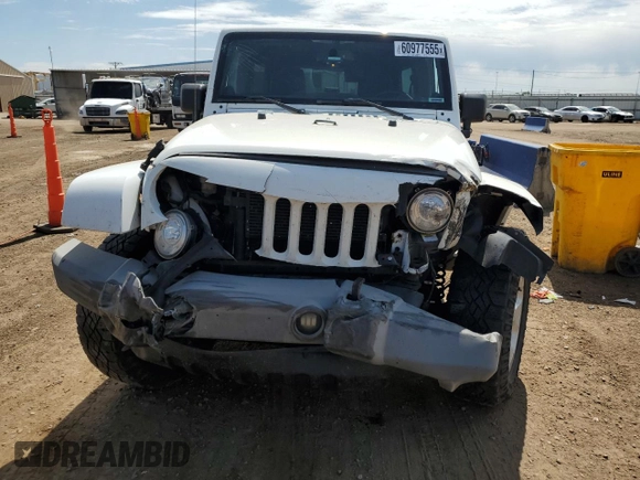 2014 Jeep Wrangler Unlimited Sahara with VIN 1C4BJWEG1EL210949, listed as a Copart auction lot 60977555 with 122,495 mi miles and Salvage title. Bid and sale history available at DreamBid. Image 5.