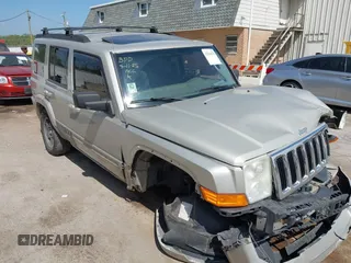2007 Jeep Commander Sport z VIN 1J8HG48K87C617899, wystawiony jako IAAI lot #42264678 z przebiegiem 206 876 mil mil oraz . Historia ofert i sprzedaży dostępna na DreamBid. Obrazek 1.