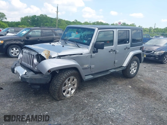 2014 Jeep Wrangler Unlimited Sahara z VIN 1C4BJWEG0EL129229, wystawiony jako IAAI lot #42380976 z przebiegiem 175 735 mil mil oraz . Historia ofert i sprzedaży dostępna na DreamBid. Obrazek 17.
