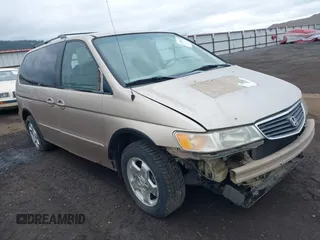 1999 Honda Odyssey EX z VIN 2HKRL1864XH504660, wystawiony jako IAAI lot #42258107 z przebiegiem 245 360 mil mil oraz . Historia ofert i sprzedaży dostępna na DreamBid. Obrazek 1.