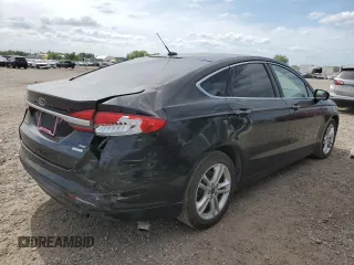 2018 Ford Fusion SE z VIN 3FA6P0HD8JR217719, wystawiony jako Copart lot #53429555 z przebiegiem 108 953 mil mil oraz Szkoda całkowita • Salvage title. Historia ofert i sprzedaży dostępna na DreamBid. Obrazek 3.