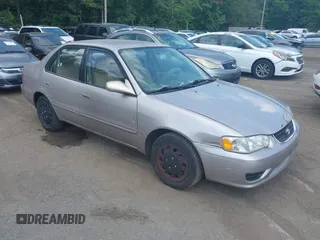 2002 Toyota Corolla CE with VIN 1NXBR12E42Z596945, listed as a IAAI auction lot 42821597 with 143,163 mi miles and . Bid and sale history available at DreamBid. Image 1.