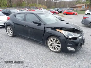 2012 Hyundai Veloster w/Gray Int z VIN KMHTC6AD6CU054422, wystawiony jako IAAI lot #41930634 z przebiegiem 144 681 mil mil oraz . Historia ofert i sprzedaży dostępna na DreamBid. Obrazek 1.