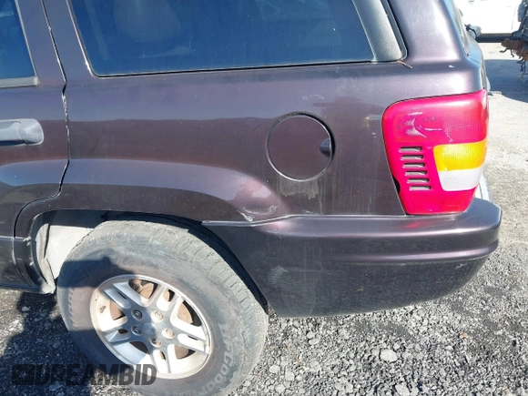 2004 Jeep Grand Cherokee with VIN 1J8GX48S24C266933, listed as a IAAI auction lot 41497122 with 200,899 mi miles and . Bid and sale history available at DreamBid. Image 6.