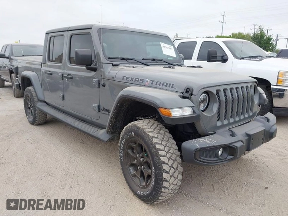 2022 Jeep Gladiator Willys with VIN 1C6JJTAMXNL137237, listed as a IAAI auction lot 41947651 with 55,199 mi miles and . Bid and sale history available at DreamBid. Image 1.