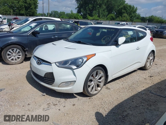 2013 Hyundai Veloster w/Black Int with VIN KMHTC6AD2DU131983, listed as a IAAI auction lot 42671646 with 131,731 mi miles and . Bid and sale history available at DreamBid. Image 2.