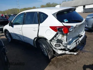 2014 Mazda CX-5 Touring with VIN JM3KE2CY5E0329783, listed as a IAAI auction lot 42017473 with 121,175 mi miles. Bid and sale history available at carsss.com. Image 3.