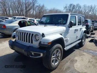 2020 Jeep Wrangler Unlimited Sahara with VIN 1C4HJXEN7LW180589, listed as a IAAI auction lot 41784143 with 58,955 mi miles. Bid and sale history available at carsss.com. Image 2.