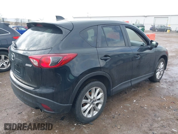 2014 Mazda CX-5 Grand Touring with VIN JM3KE4DY5E0373731, listed as a IAAI auction lot 41517852 with 148,414 mi miles. Bid and sale history available at carsss.com. Image 4.
