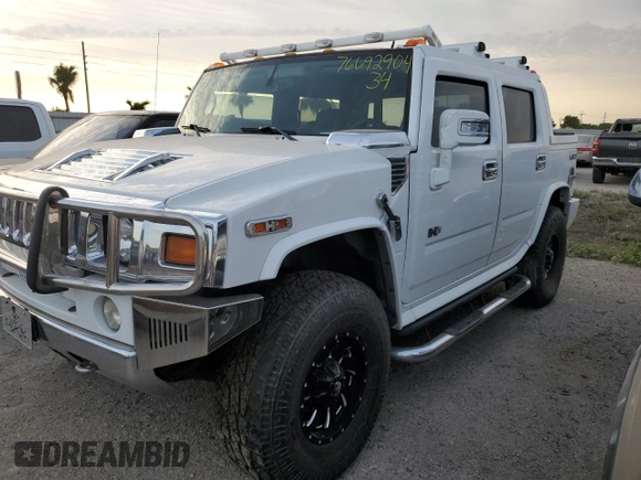 2006 Hummer H2 with VIN 5GRGN22U56H105928, listed as a Copart auction lot 76692904 with 0 mi miles and Salvage Title. Bid and sale history available at carsss.com. Image 1.