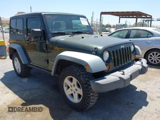 2011 Jeep Wrangler Rubicon z VIN 1J4BA6D11BL556342, wystawiony jako IAAI lot #42465252 z przebiegiem 80 377 mil mil oraz . Historia ofert i sprzedaży dostępna na DreamBid. Obrazek 1.
