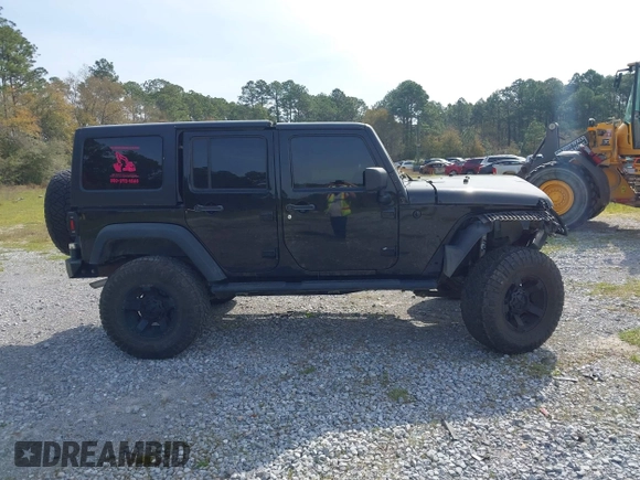 2012 Jeep Wrangler Unlimited Sport with VIN 1C4BJWDG2CL258264, listed as a IAAI auction lot 41880235 with 173,661 mi miles. Bid and sale history available at carsss.com. Image 14.