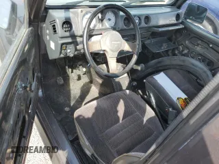 1986 Suzuki Samurai z VIN JS3JC51V8G4110639, wystawiony jako Copart lot #75466894 z przebiegiem Nie podano mil oraz Szkody całkowita. Historia ofert i sprzedaży dostępna na DreamBid. Obrazek 8.