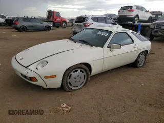1984 Porsche 928 z VIN WP0JB0921ES860293, wystawiony jako Copart lot #70132694 z przebiegiem 134 907 mil mil oraz Tytuł czysty. Historia ofert i sprzedaży dostępna na DreamBid. Obrazek 1.