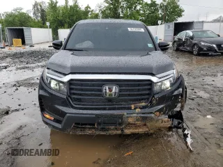 2023 Honda Ridgeline RTL with VIN 5FPYK3F51PB067811, listed as a Copart auction lot 56795995 with 21,500 mi miles and Salvage title. Bid and sale history available at DreamBid. Image 5.