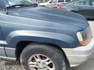 2002 Jeep Grand Cherokee Laredo with VIN 1J4GW48S92C150162, listed as a IAAI auction lot 42471732 with 171,677 mi miles and . Bid and sale history available at DreamBid. Image 17.