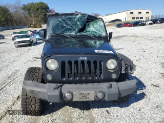 2014 Jeep Wrangler Unlimited Sport with VIN 1C4BJWDG9EL250326, listed as a Copart auction lot 48545705 with 247,460 mi miles and Salvage Title. Bid and sale history available at DreamBid. Image 5.