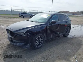 2018 Mazda CX-5 Touring with VIN JM3KFBCMXJ0438177, listed as a IAAI auction lot 42152275 with 65,434 mi miles and . Bid and sale history available at carsss.com. Image 17.