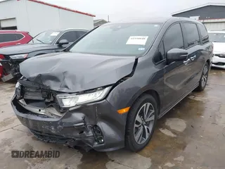 2021 Honda Odyssey Touring with VIN 5FNRL6H86MB021504, listed as a IAAI auction lot 41550040 with 55,068 mi miles. Bid and sale history available at carsss.com. Image 2.