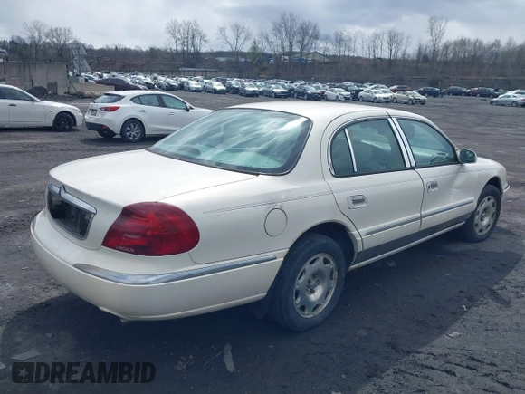 1998 Lincoln Continental with VIN 1LNFM97V2WY738814, listed as a IAAI auction lot 41992844 with 147,066 mi miles. Bid and sale history available at carsss.com. Image 4.